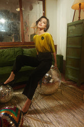 Soft velvet blouse with 3/4 sleeves and gathered waistline for elegant evening styling